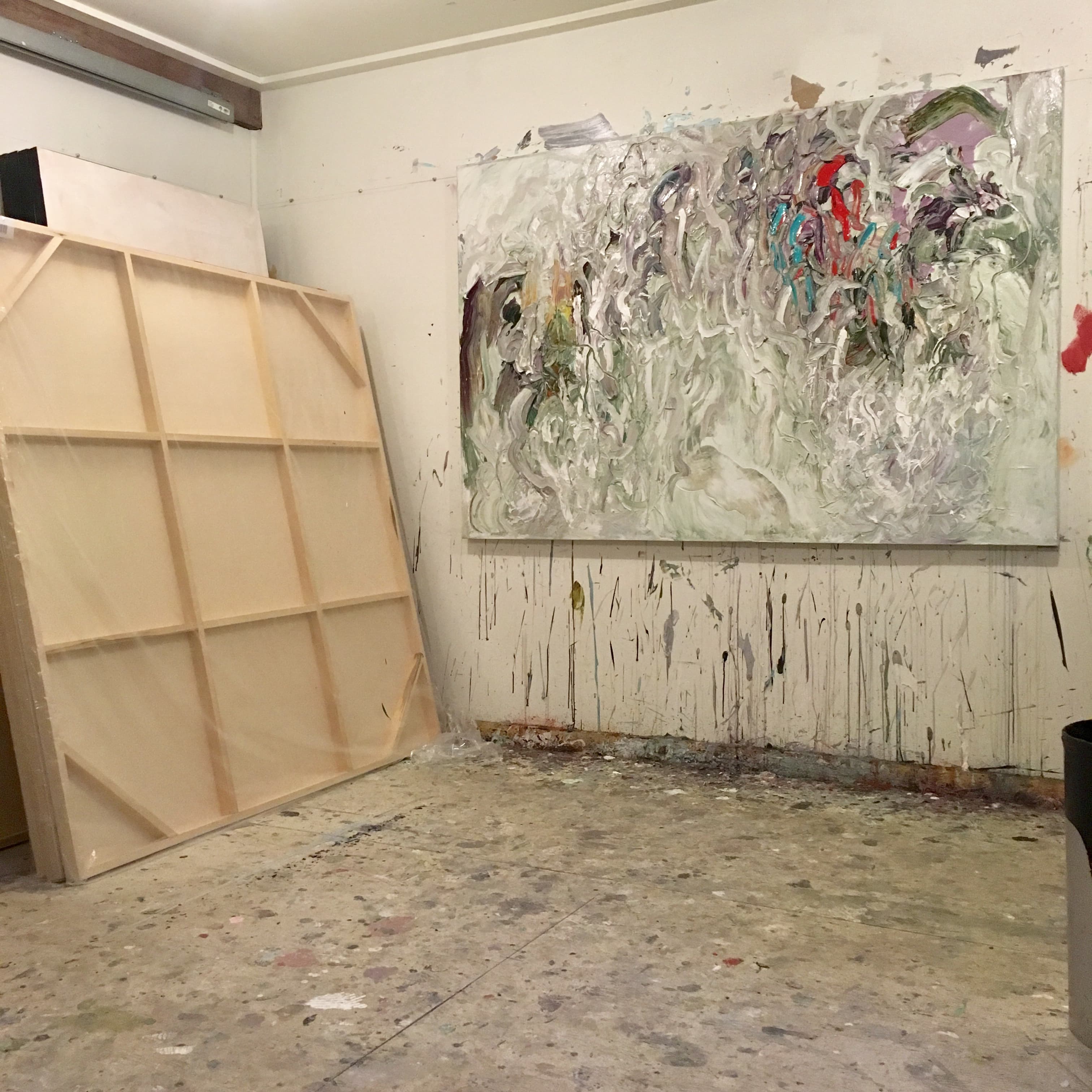 Shane Norrie studio with a large work in progress and blank canvas
