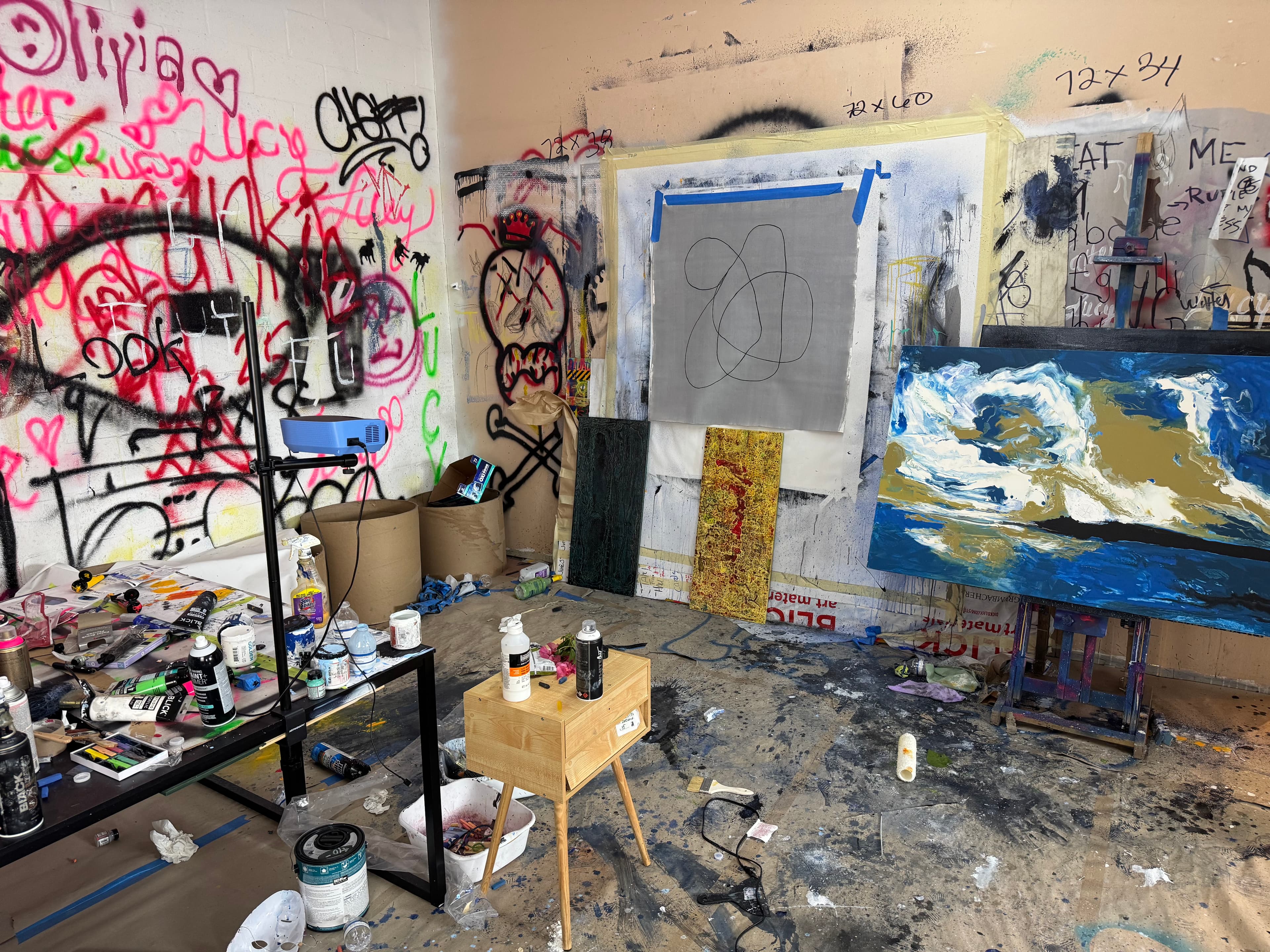Andrew Lennon studio with graffiti walls and works in progress