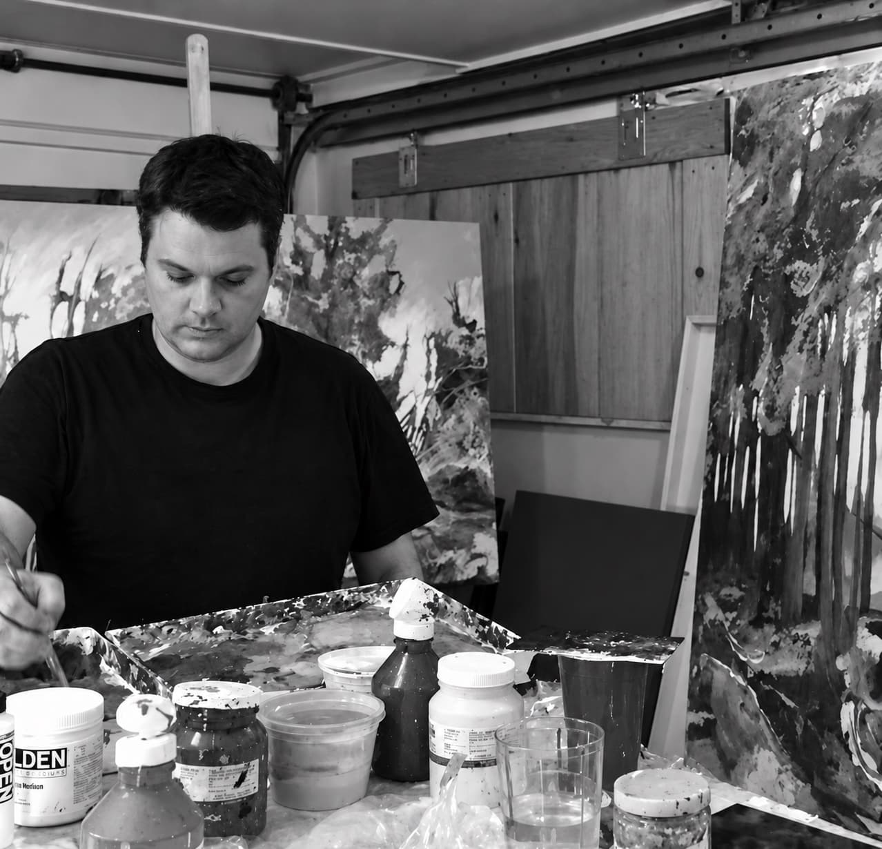 Shane Norrie painting in his studio