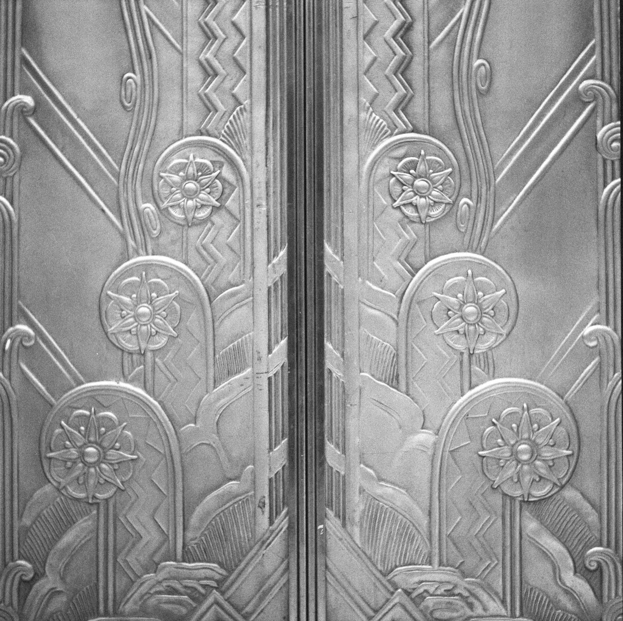 Close-up of floral and chevron relief on the Art Deco elevator doors at 116 John Street