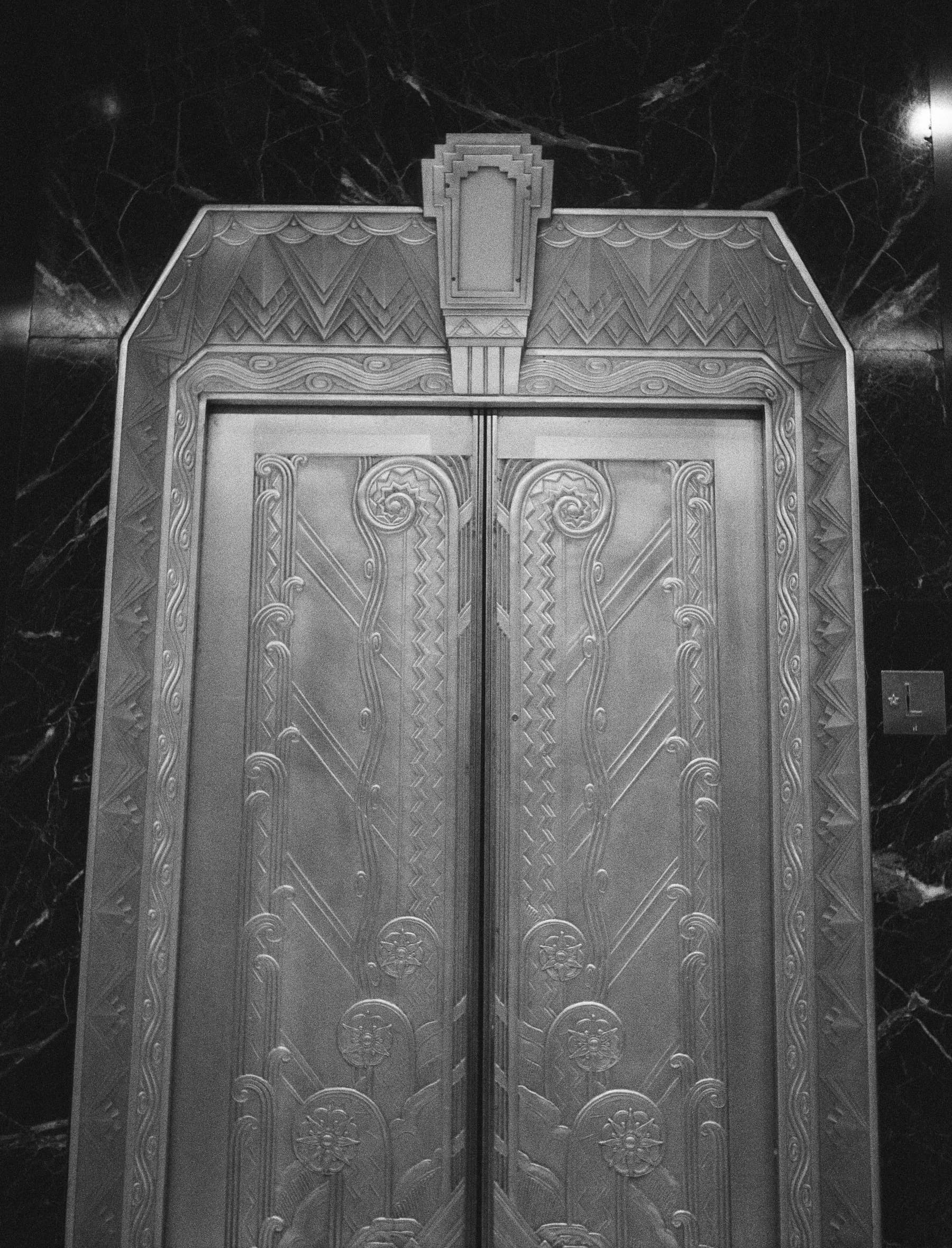 Art Deco elevator doors in black marble at 116 John Street