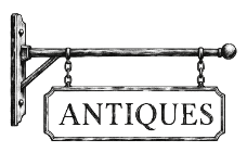Hanging shop sign that reads Antiques
