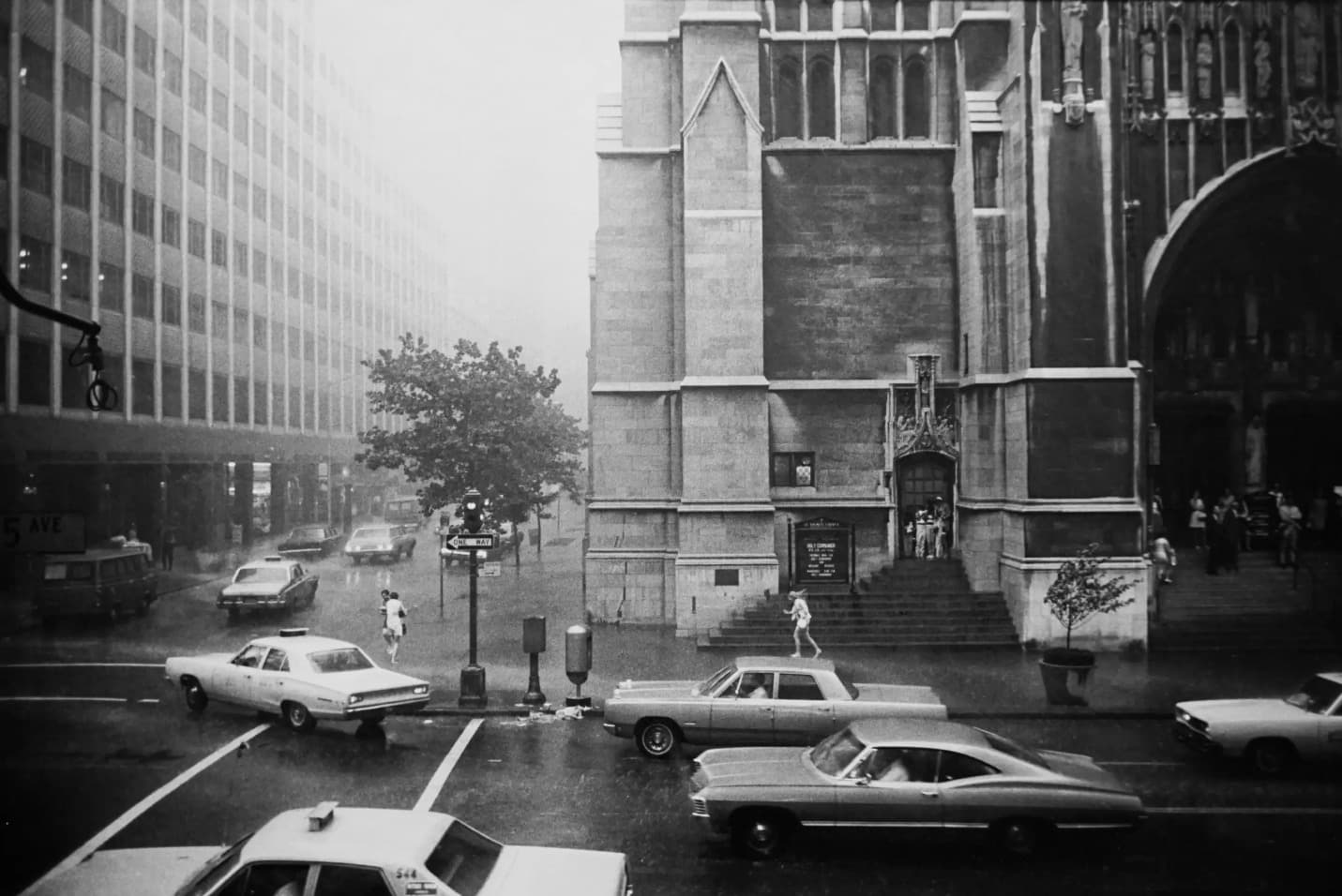 Garry Winogrand, 5th Avenue and 54th St. in the Rain, New York, 1968