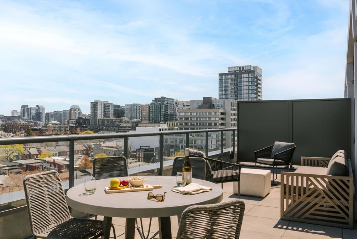 Spacious apartment living room with contemporary furnishings at Nester Finn West Queen West in West Queen West, Toronto